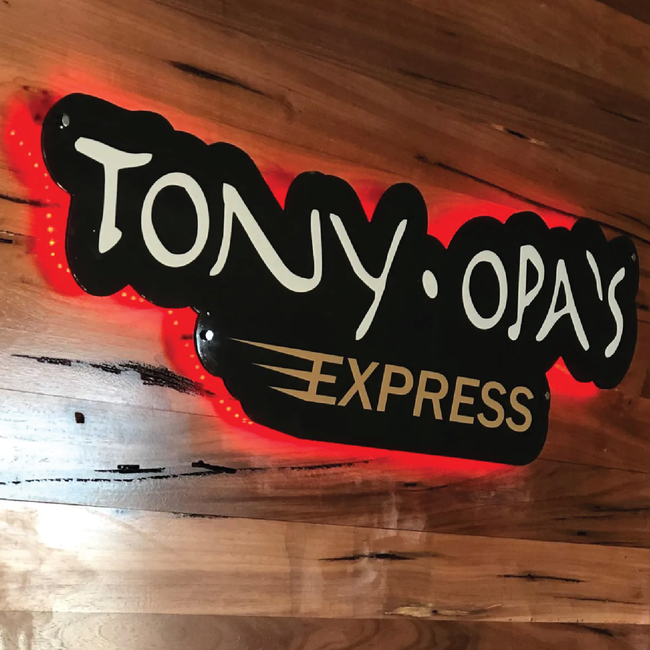 A tony opa 's express sign on a wooden wall