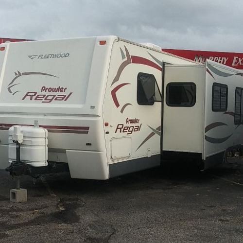 A prowler regal trailer is parked next to another trailer
