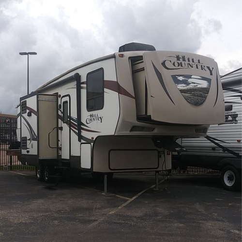 A prowler regal trailer is parked next to another trailer
