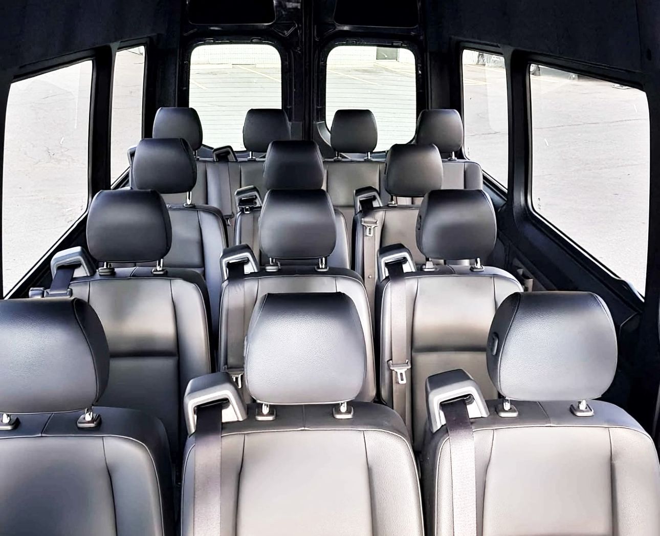 A 15 passenger van inside view from the front.