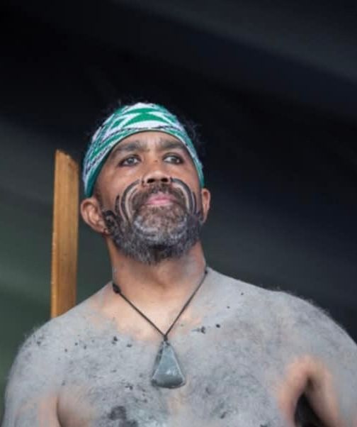 A man with a beard and a bandana on his head
