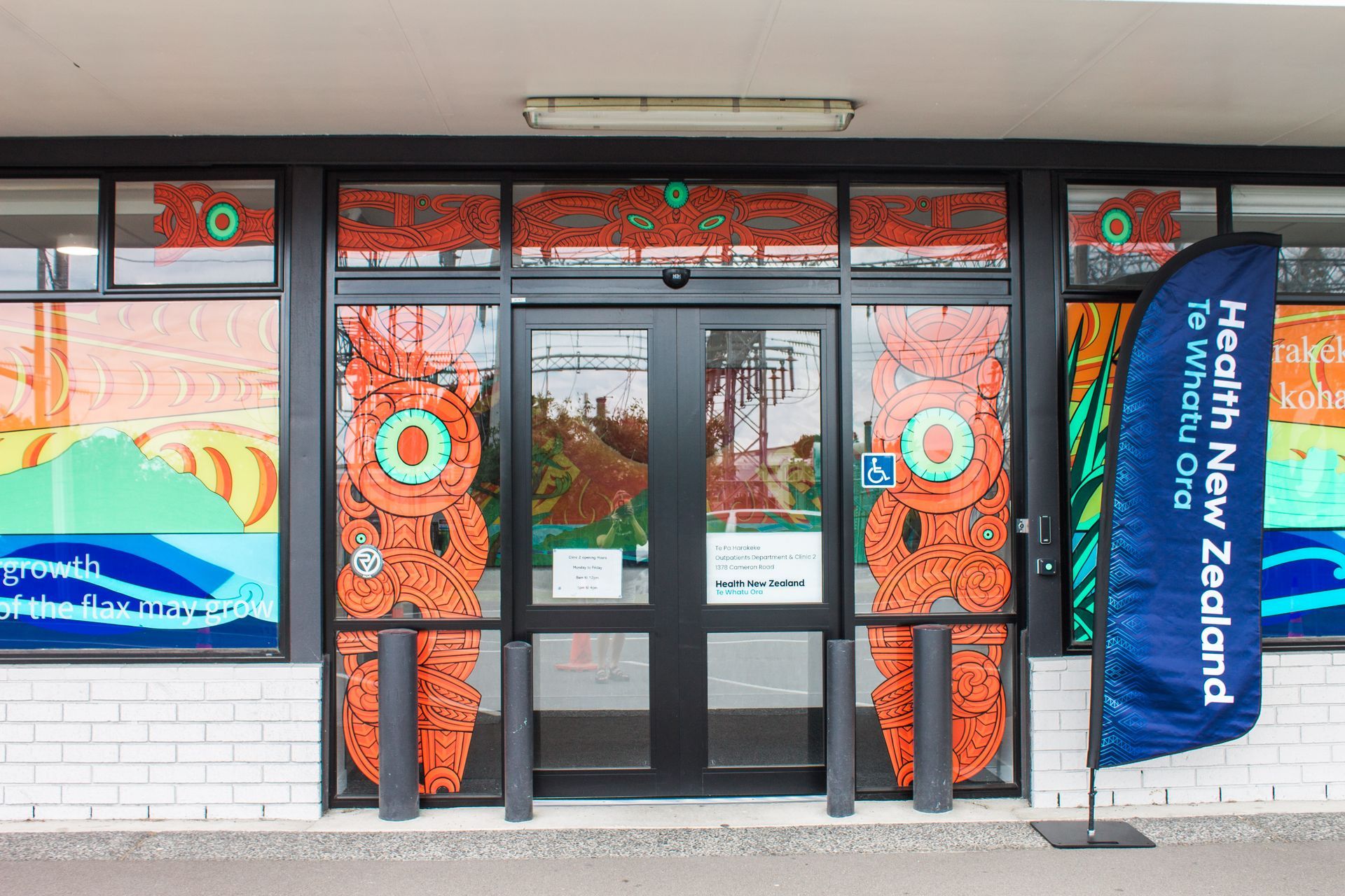 A building with a blue flag that says health new zealand