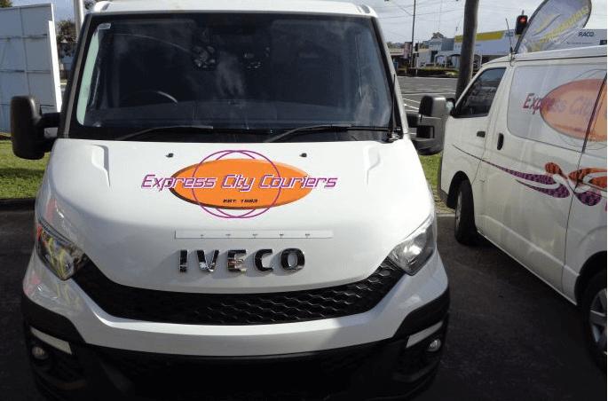 A White Van With Express Dry Couriers Written On The Front — Express City Couriers in Bungalow, QLD