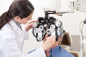 A man taking comprehensive eye examination — New London, WI — Griebenow Eyecare Sc Clintonville