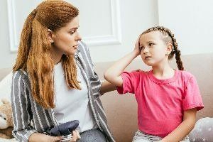 A lady talking with her child — New London, WI — Griebenow Eyecare Sc Clintonville