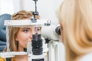 A young lady taking an eye test — New London, WI — Griebenow Eyecare Sc Clintonville
