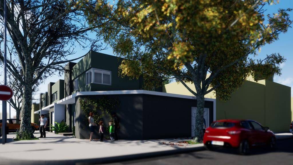 Edificio moderno con fachada oscura, gente en la entrada, coche rojo aparcado, escena callejera.