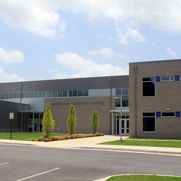A large brick building with a sign that says no parking