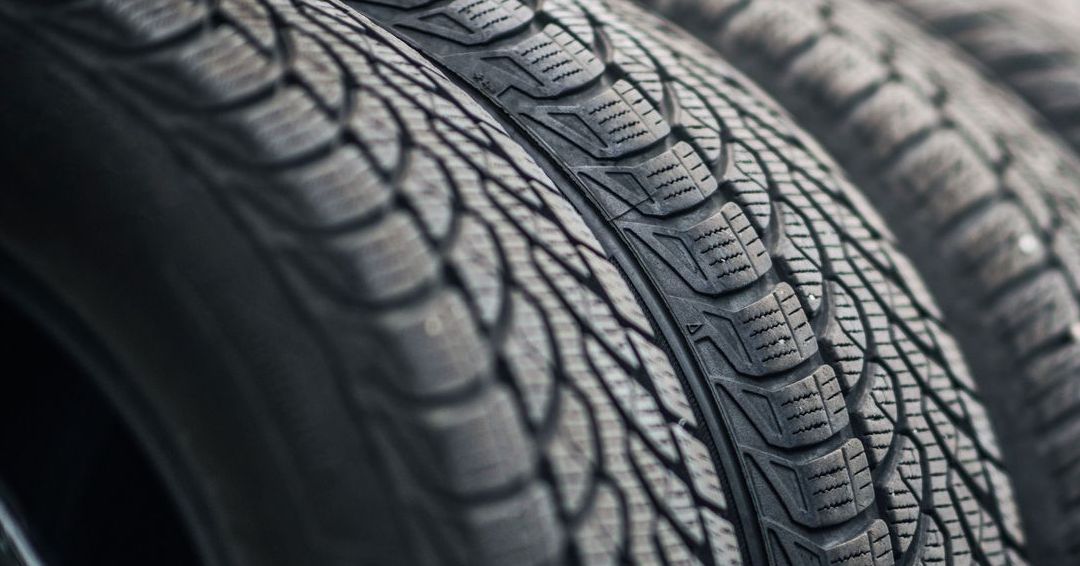 A close up of a stack of tires sitting on top of each other.