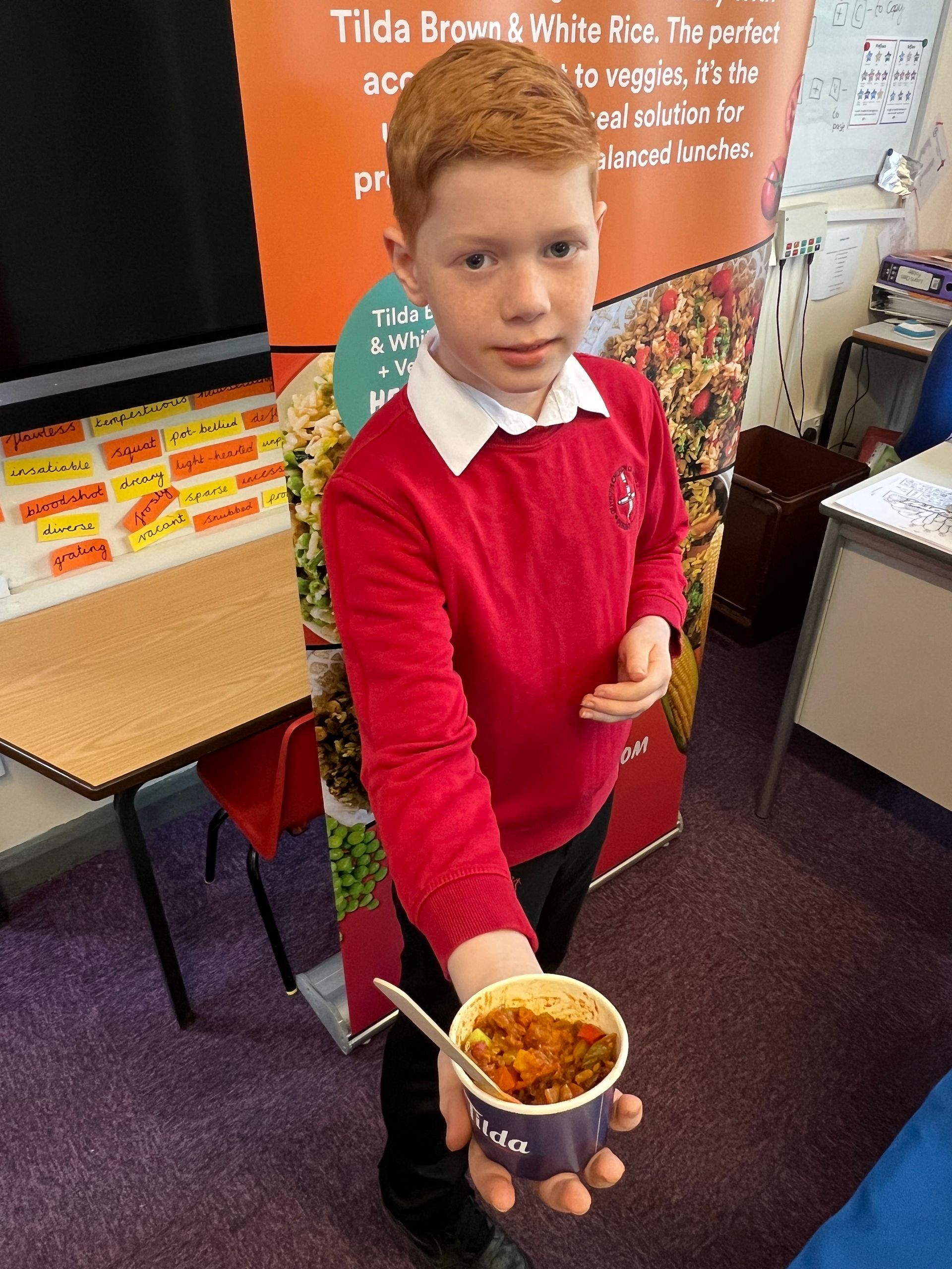 A Guyhirn pupil with a bowl of jollof