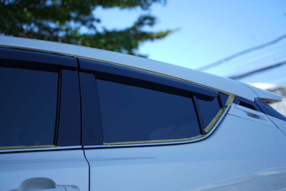 A Close Up Of A White Car With Black Windows — CQ Auto Tint In Kawana, QLD