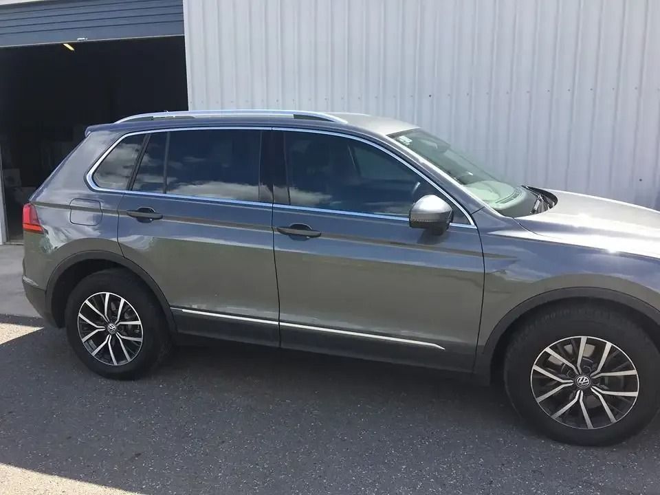 A Volkswagen Tiguan Is Parked In Front Of A Garage — CQ Auto Tint In Kawana, QLD