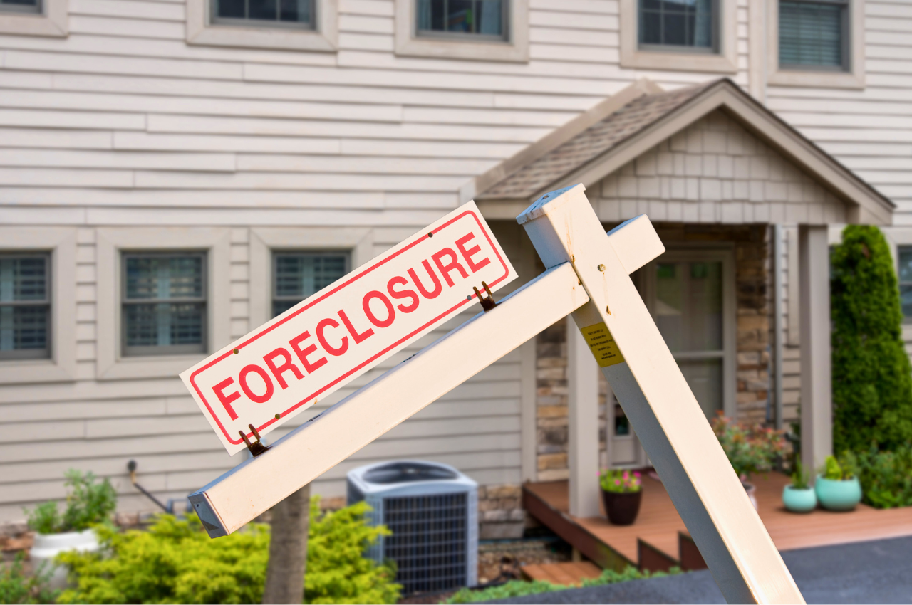 Foreclosure sign in front of a house