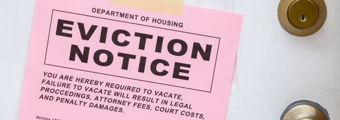 pink eviction notice on a door