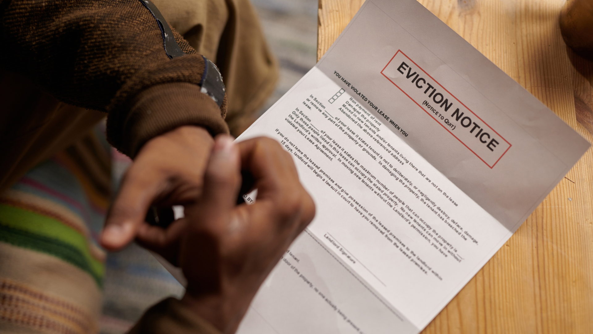 Person reading legal eviction notice