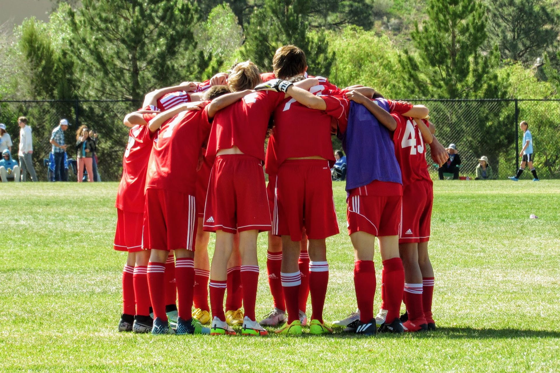 Montrose Avalanche Soccer Club team in a huddle