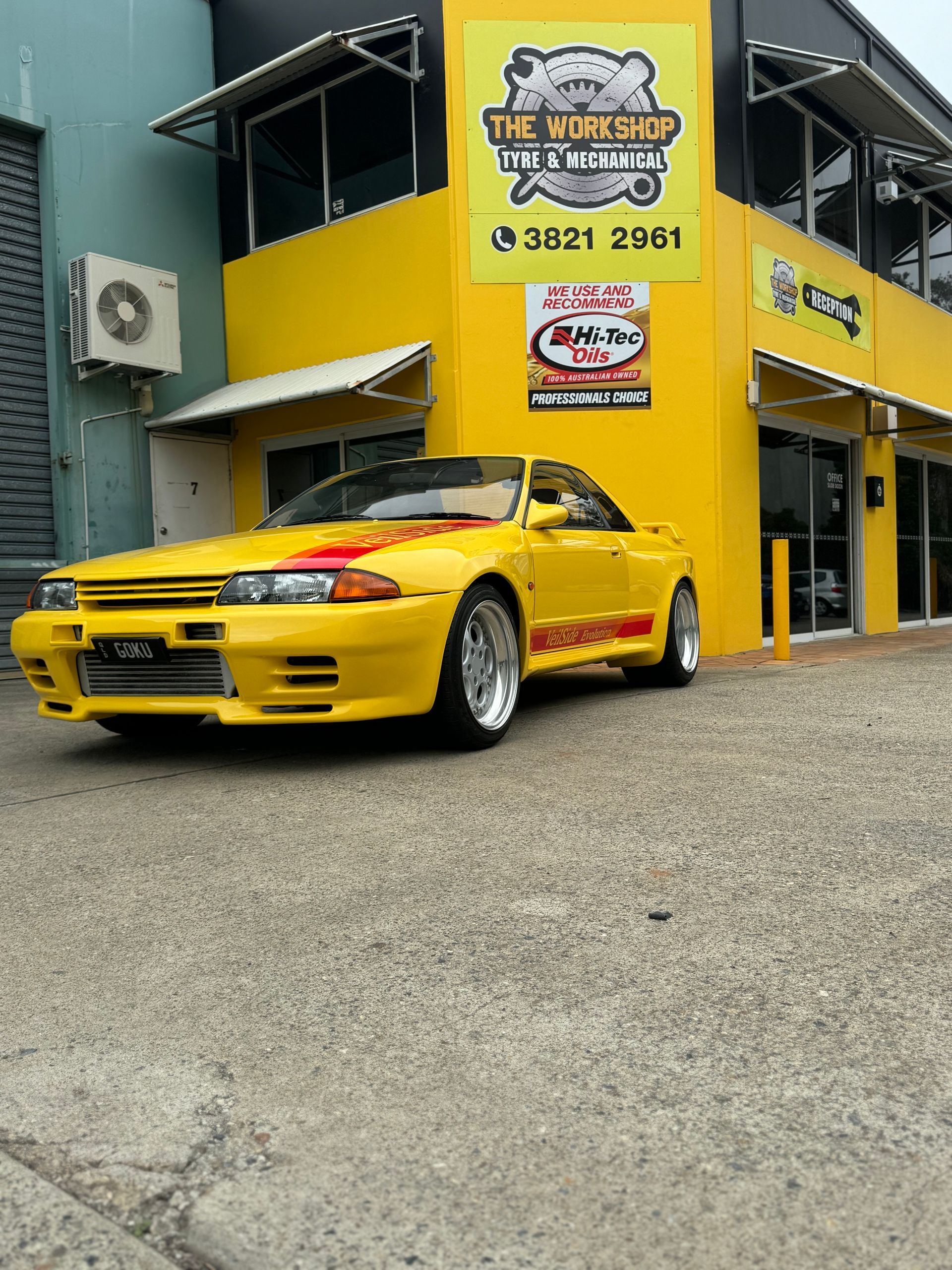 A Man Is Working on A Car Engine — HO Performance in Cleveland, QLD