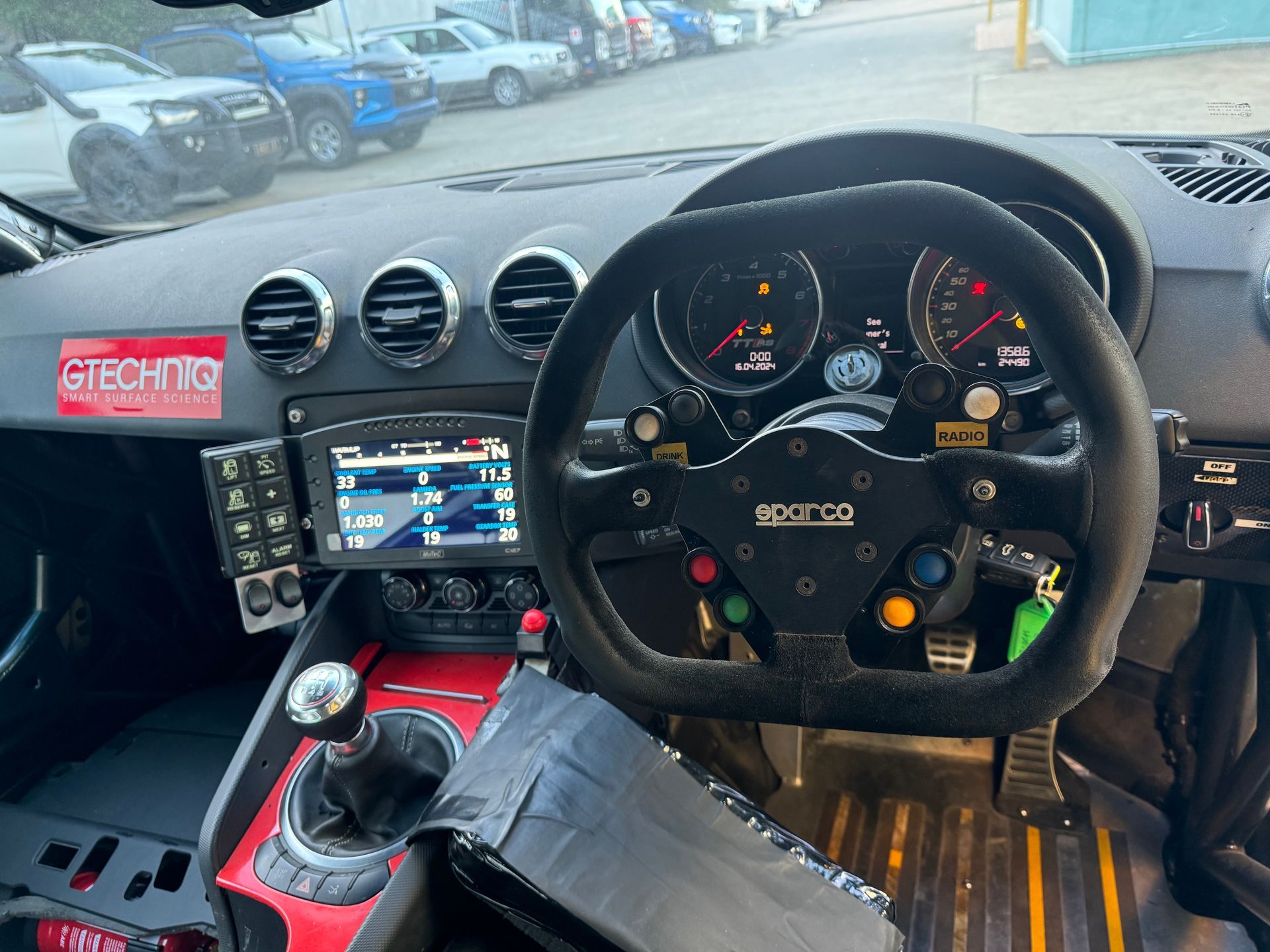 The inside of a car with a steering wheel and a sticker that says techno  HO Performance in Cleveland, QLD