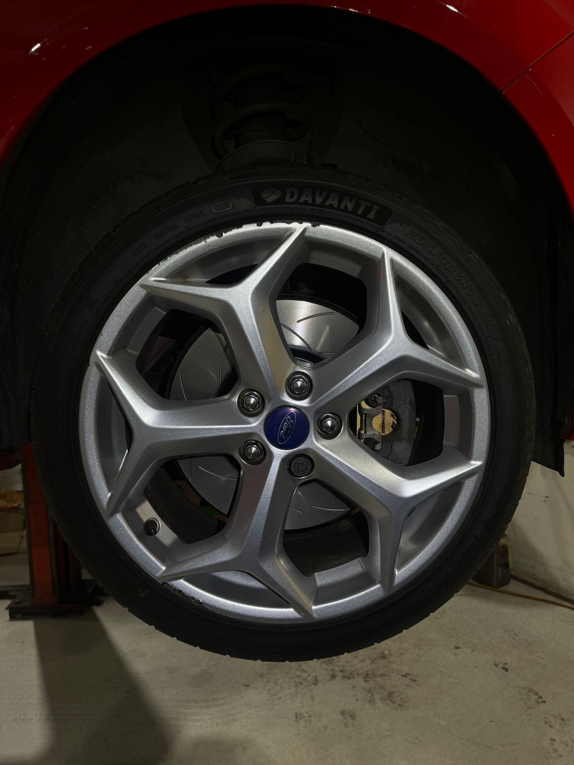 A close up of a car wheel with a ford logo on it — HO Performance in Cleveland, QLD