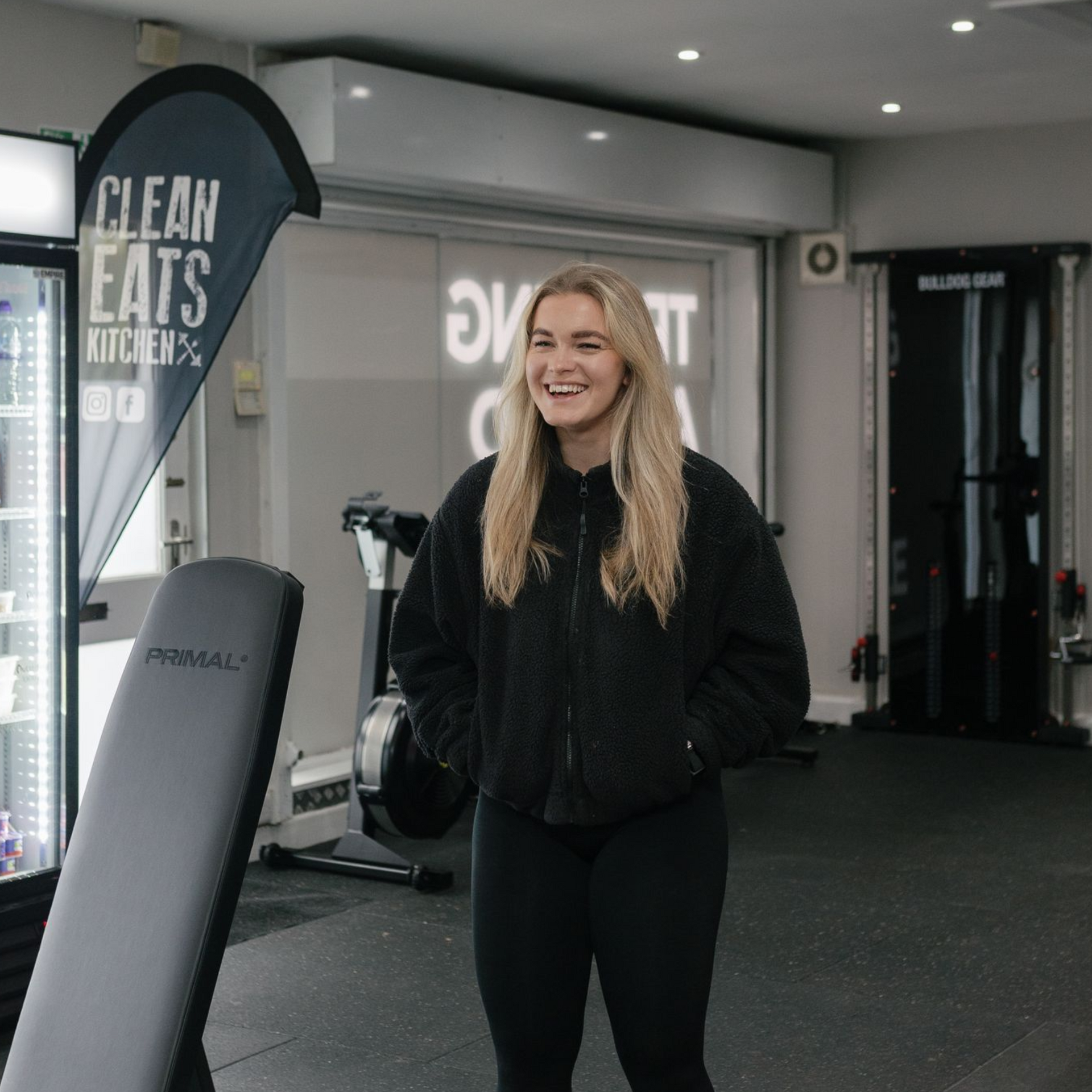 A man with a beard and blue eyes is wearing a black shirt