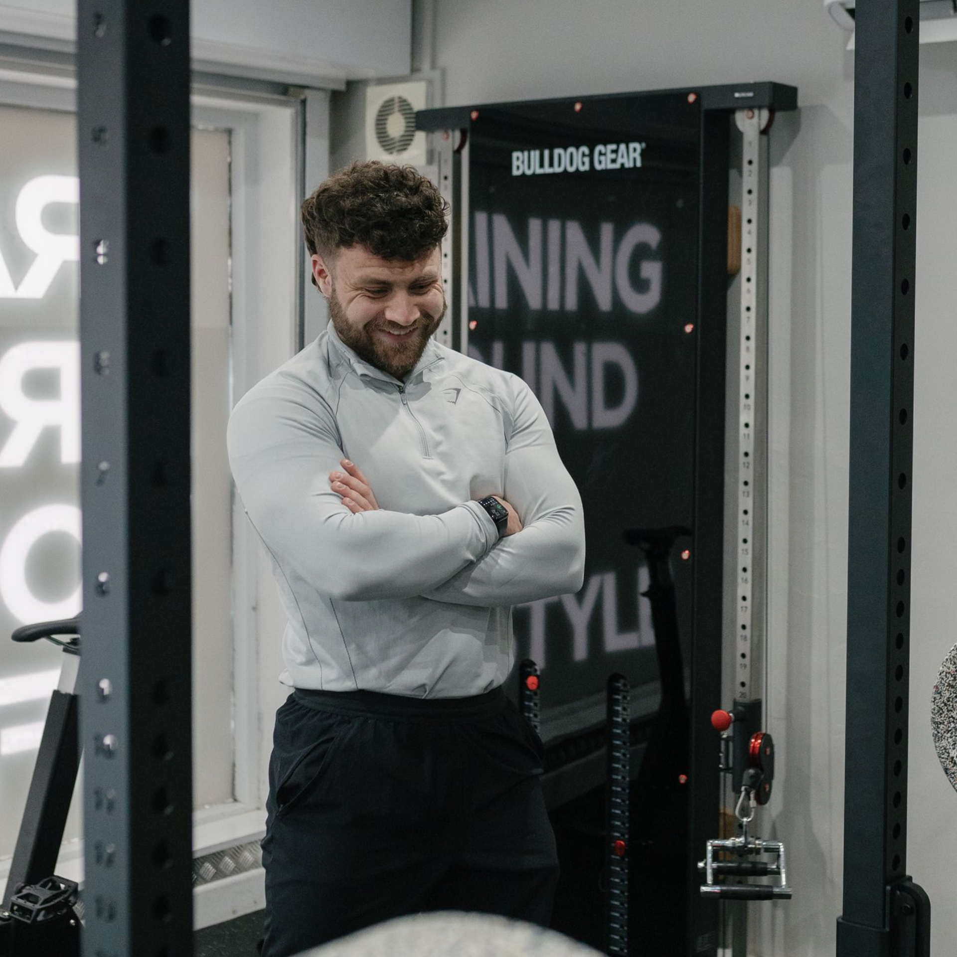 A man with a beard and blue eyes is wearing a black shirt