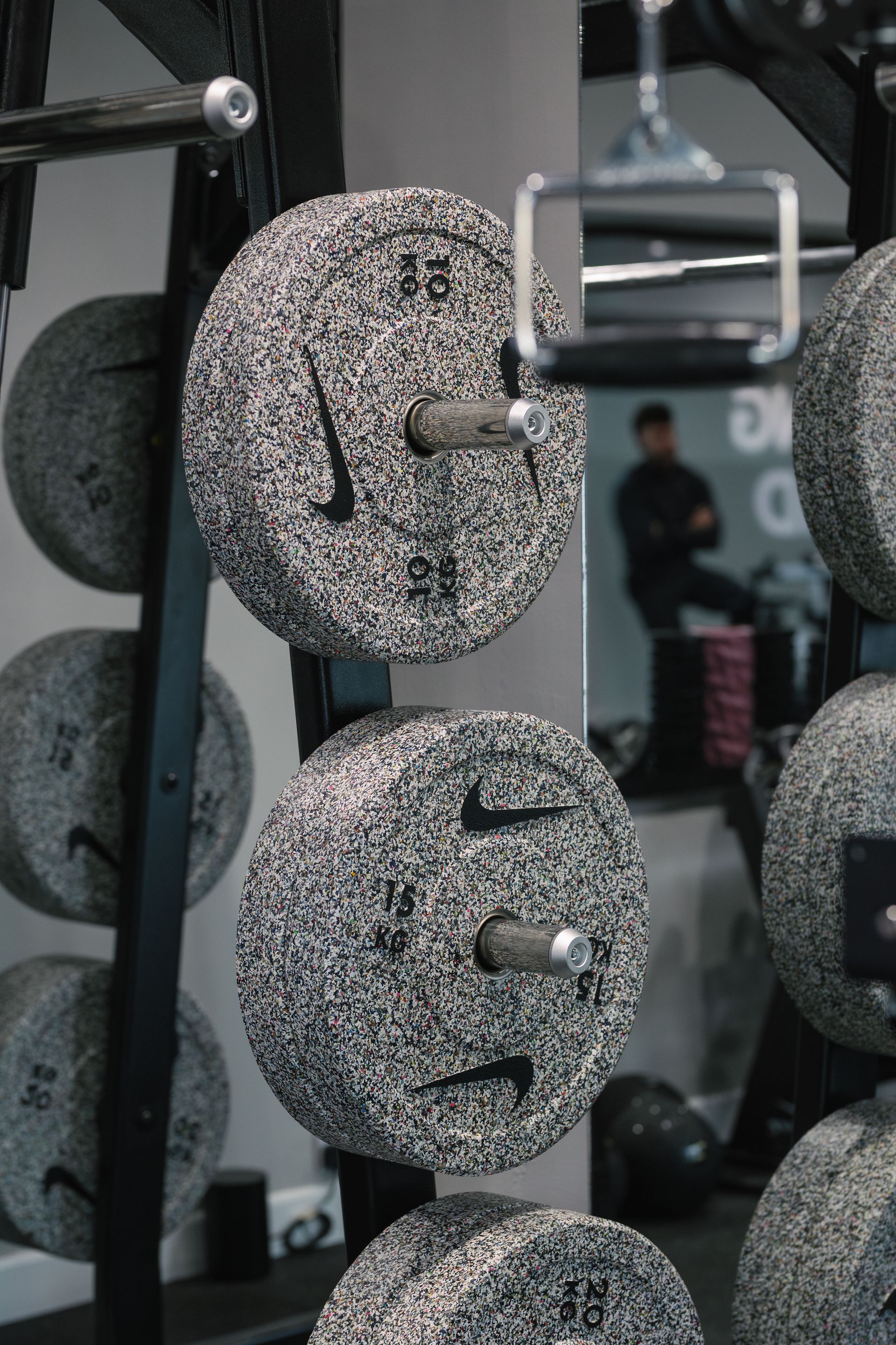 A man is using a hoist machine in a gym