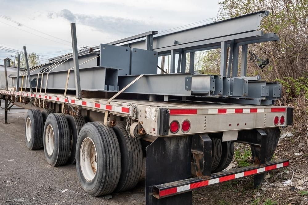 A Semi Truck is Carrying a Large Metal Structure on a Trailer — Bulahdelah Towing In Stroud, NSW