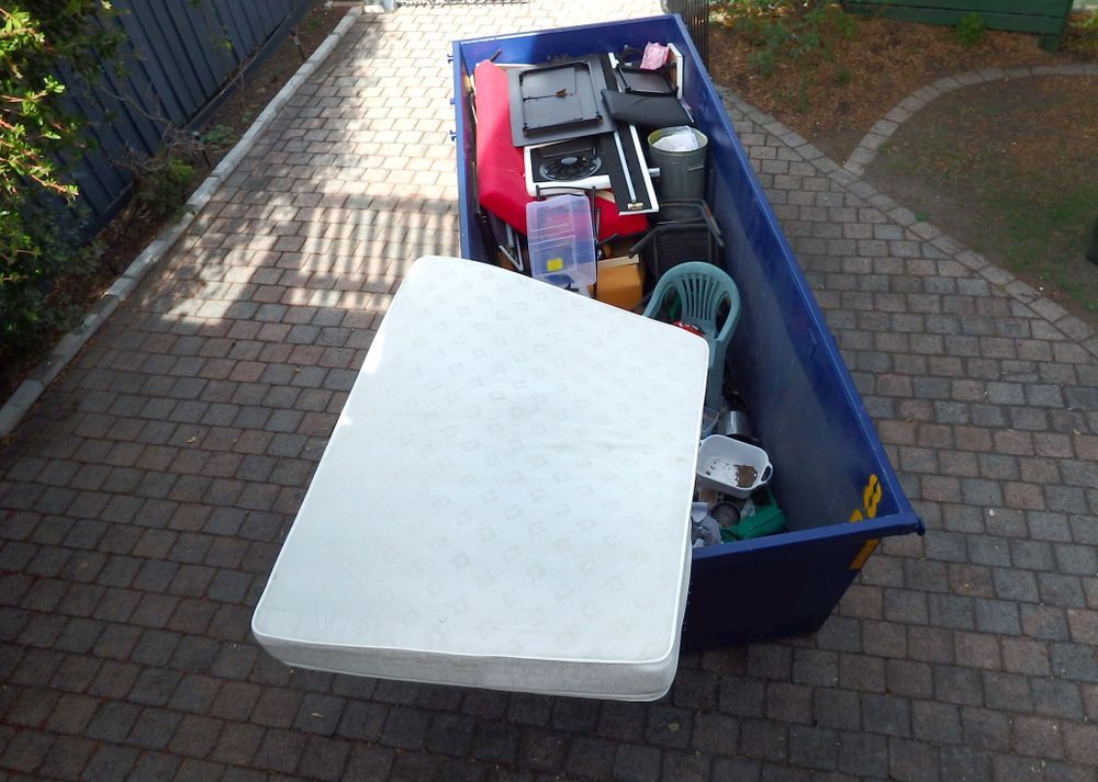 Blue Dumpster Filled With Items — Tamworth Skips and Rubbish Removal in Gunnedah, NSW