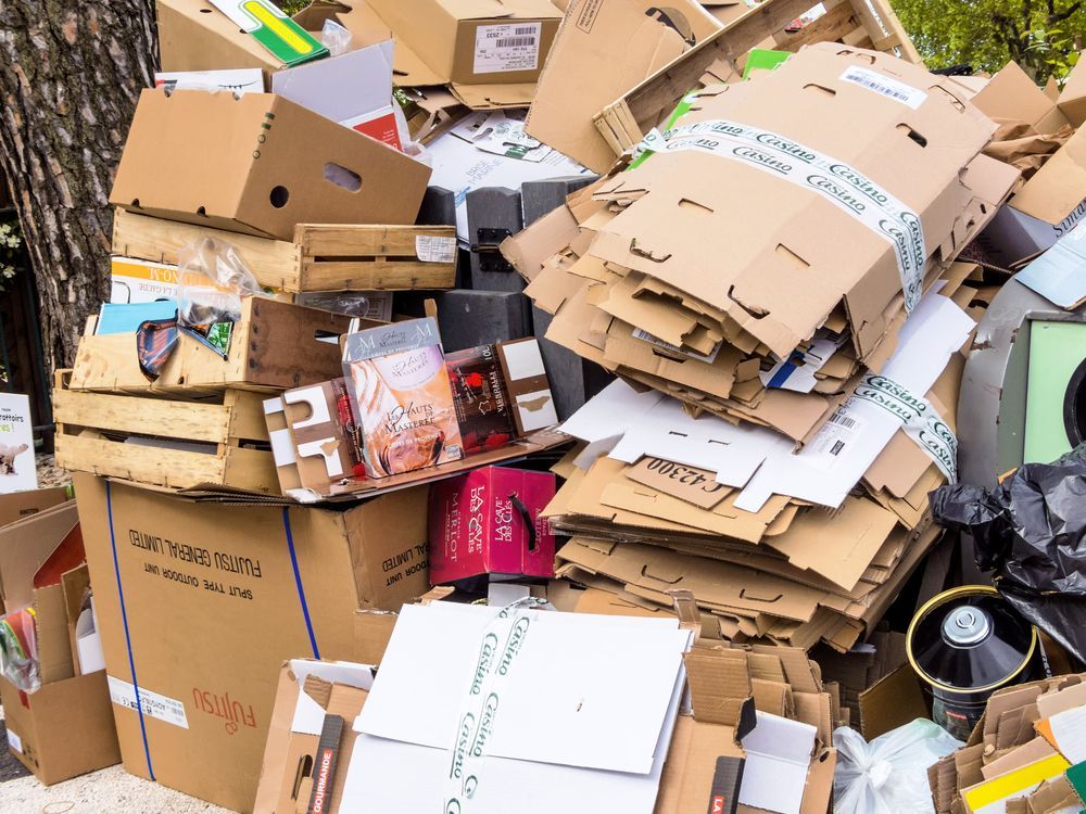 Pile of Flattened Cardboard Boxes and Wooden Crates — Tamworth Skips and Rubbish Removal in South Tamworth, NSW