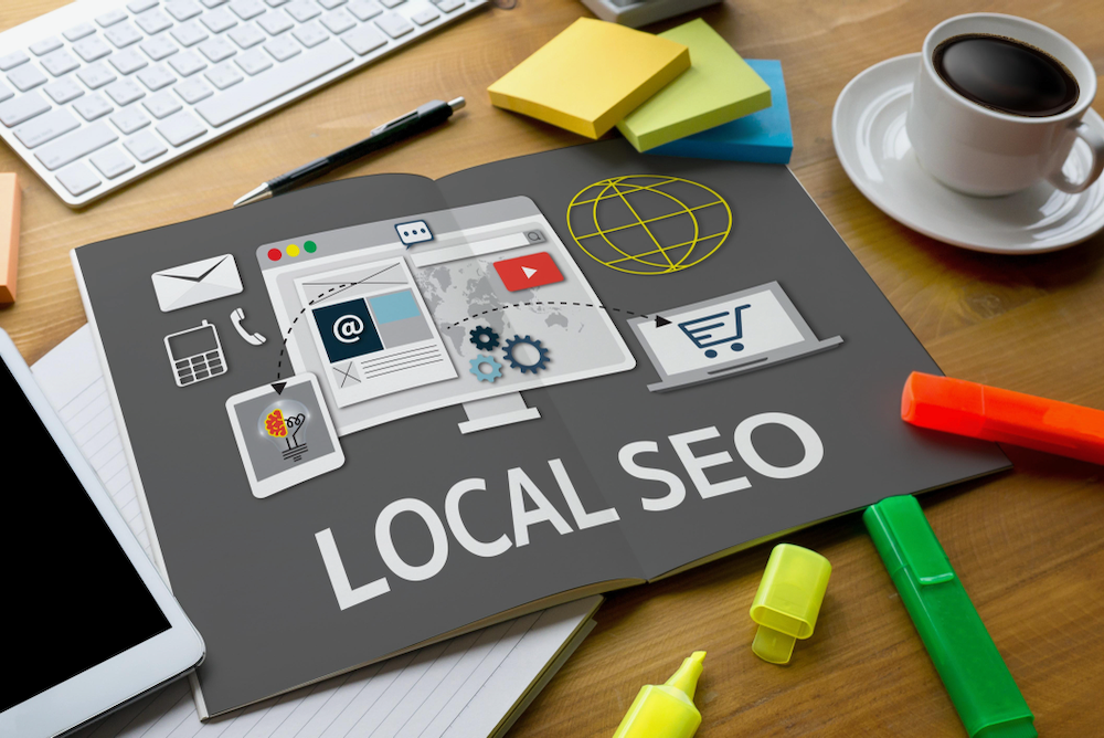 A book is open to a page that says `` local seo ''.