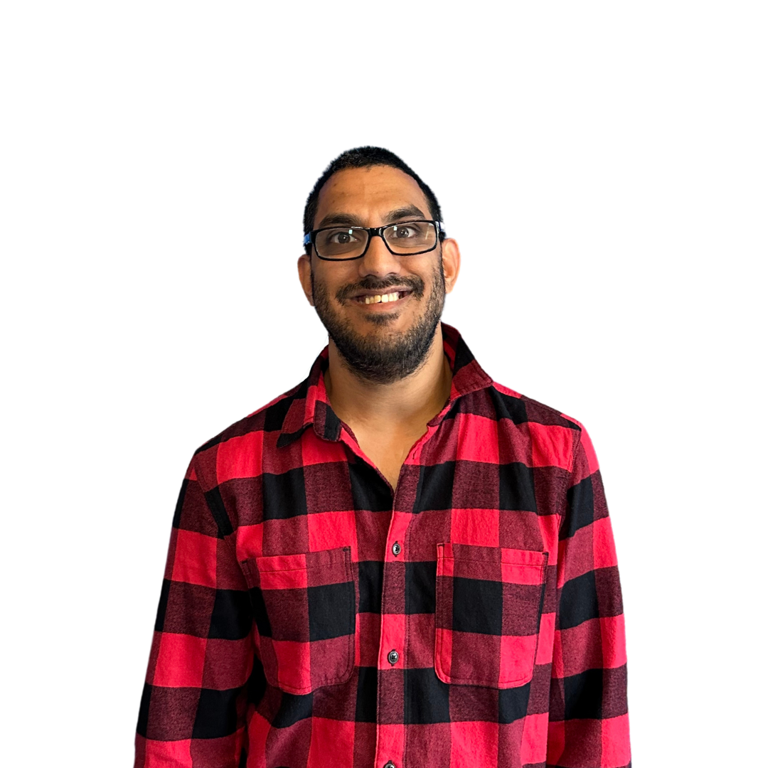 A man wearing glasses and a red and black plaid shirt