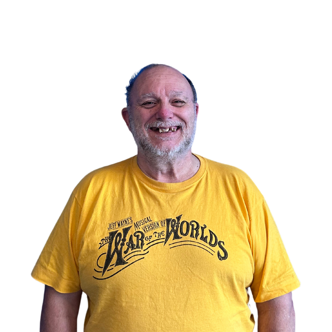 a man wearing yellow tshirt smiling
