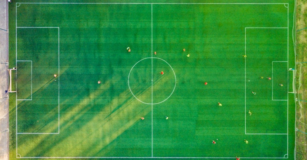 An aerial view of a soccer field with players on it.