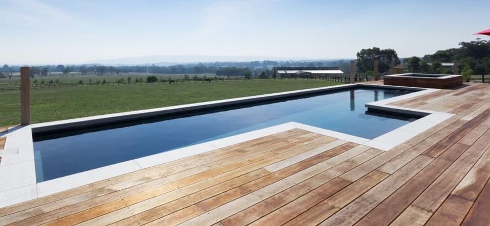 Swimming Pool with Wooden Deck — Swan Hill Pool & Spa Centre in Swan Hill, VIC