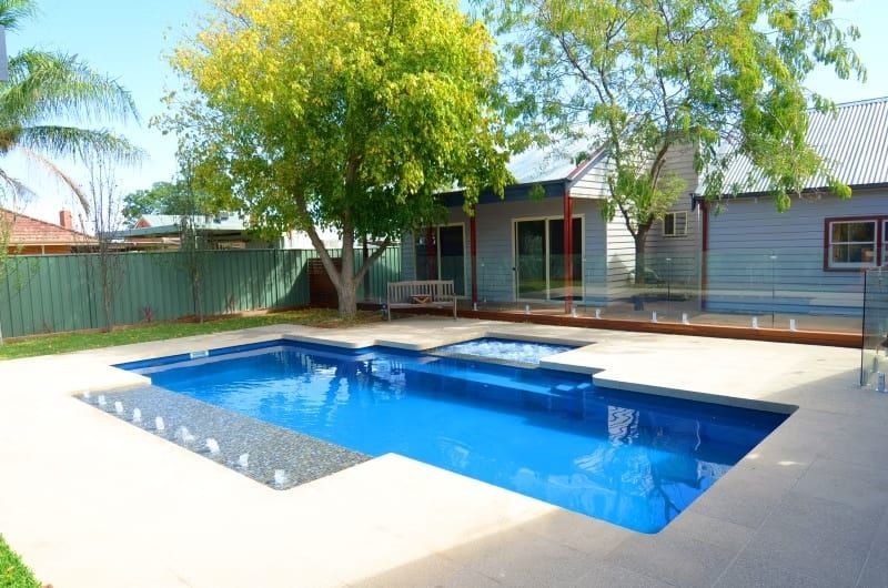 Backyard with Blue Swimming Pool and Spa — Swan Hill Pool & Spa Centre in Swan Hill, VIC