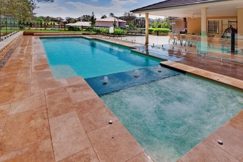 Swimming Pool with A Tan Stone Deck — Swan Hill Pool & Spa Centre in Swan Hill, VIC