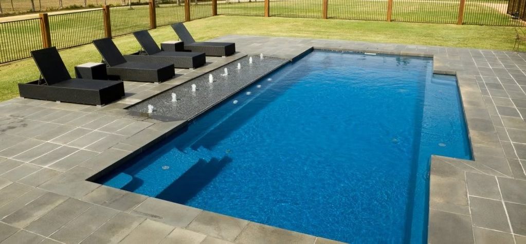A Rectangular Blue Pool with Loungers — Swan Hill Pool & Spa Centre in Swan Hill, VIC