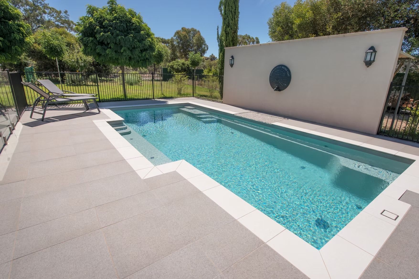 A Rectangular Pool with A Light Grey Deck — Swan Hill Pool & Spa Centre in Swan Hill, VIC