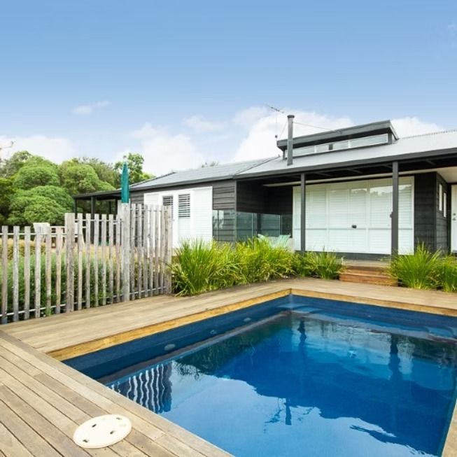 A Modern House with A Small Blue Pool — Swan Hill Pool & Spa Centre in Swan Hill, VIC