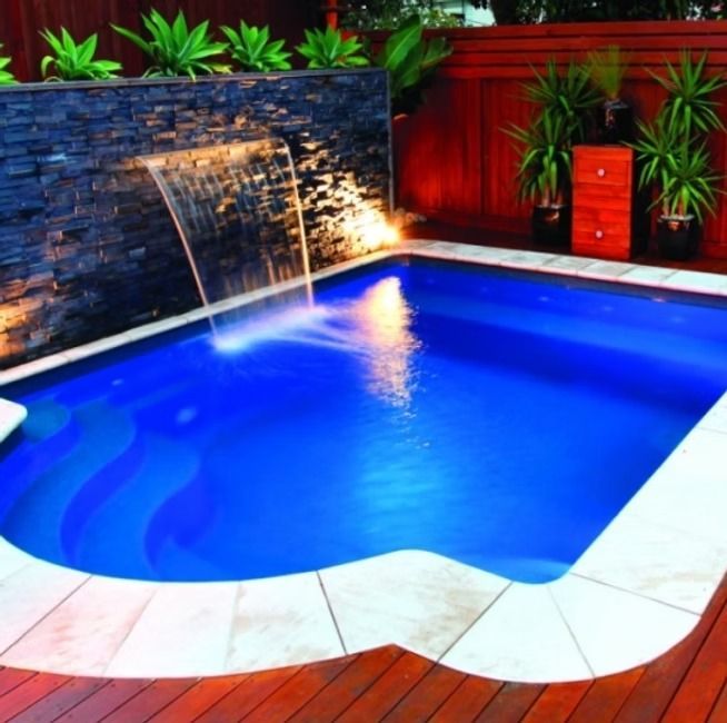 A Small Blue Swimming Pool with A Waterfall — Swan Hill Pool & Spa Centre in Swan Hill, VIC