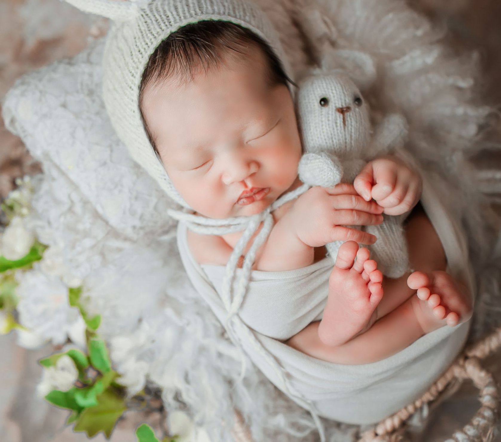 Peacefully sleeping newborn supported by postpartum doula care