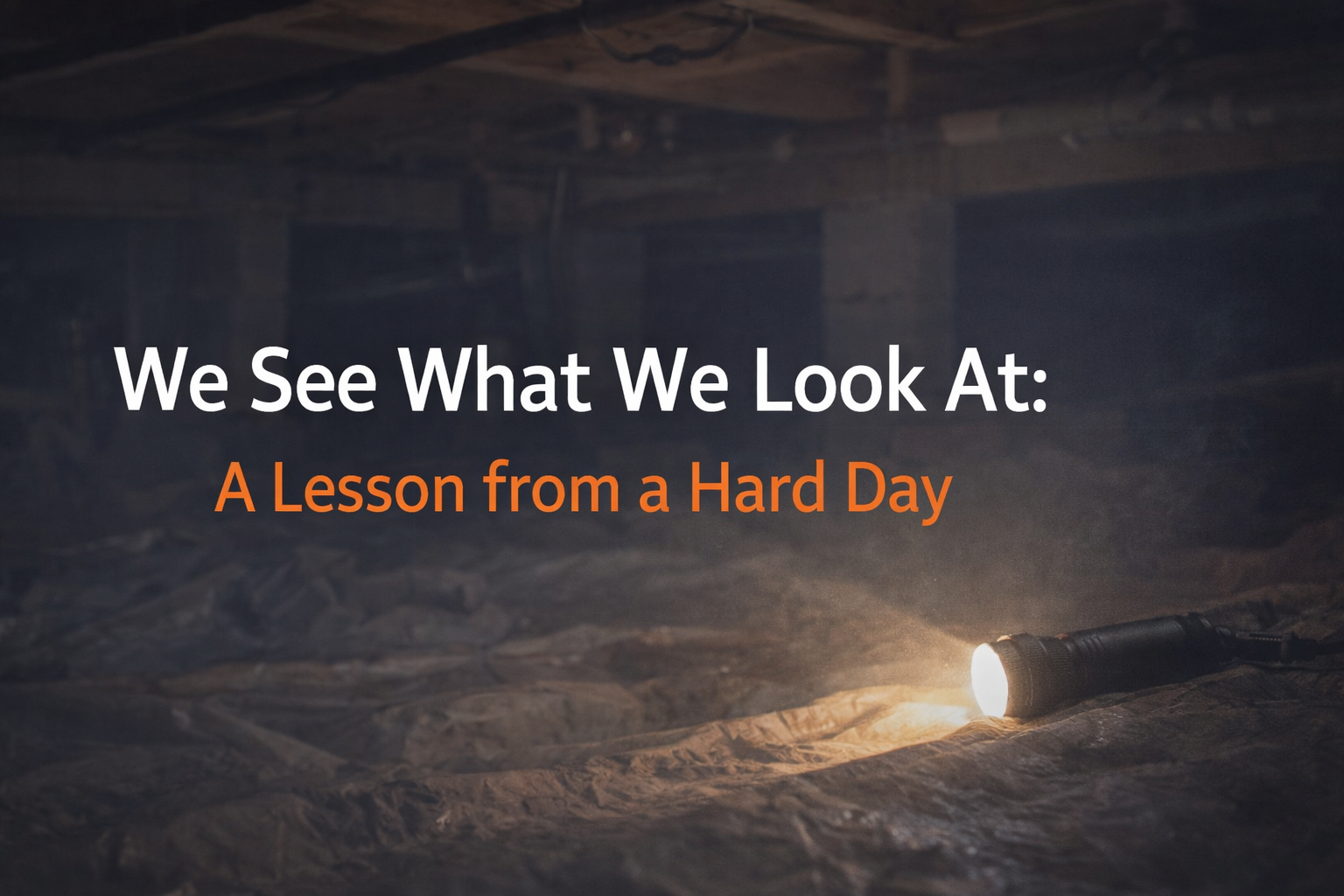 A flashlight illuminates a dark, dusty crawl space, with the text 