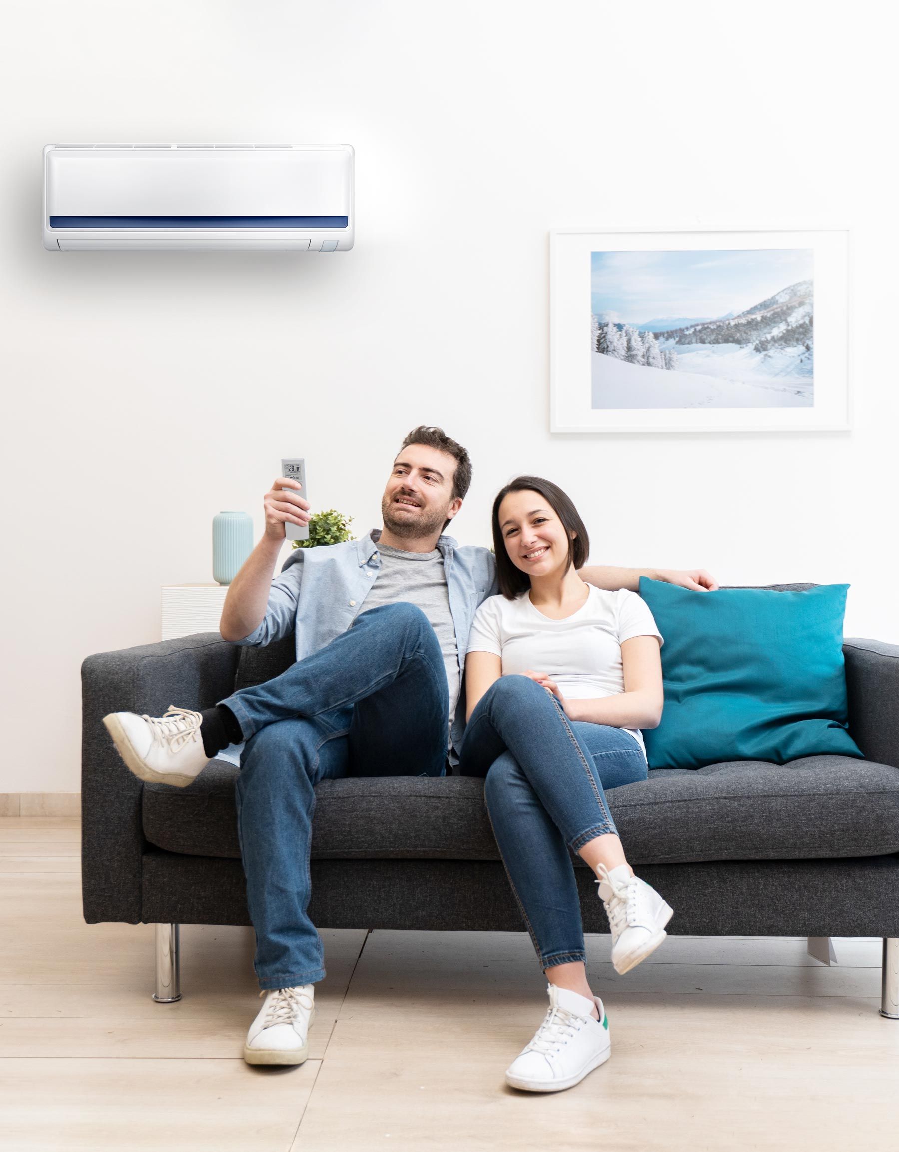 Happy Couple Under Air Conditioner — Randleman, NC — Evans Air Services Inc.