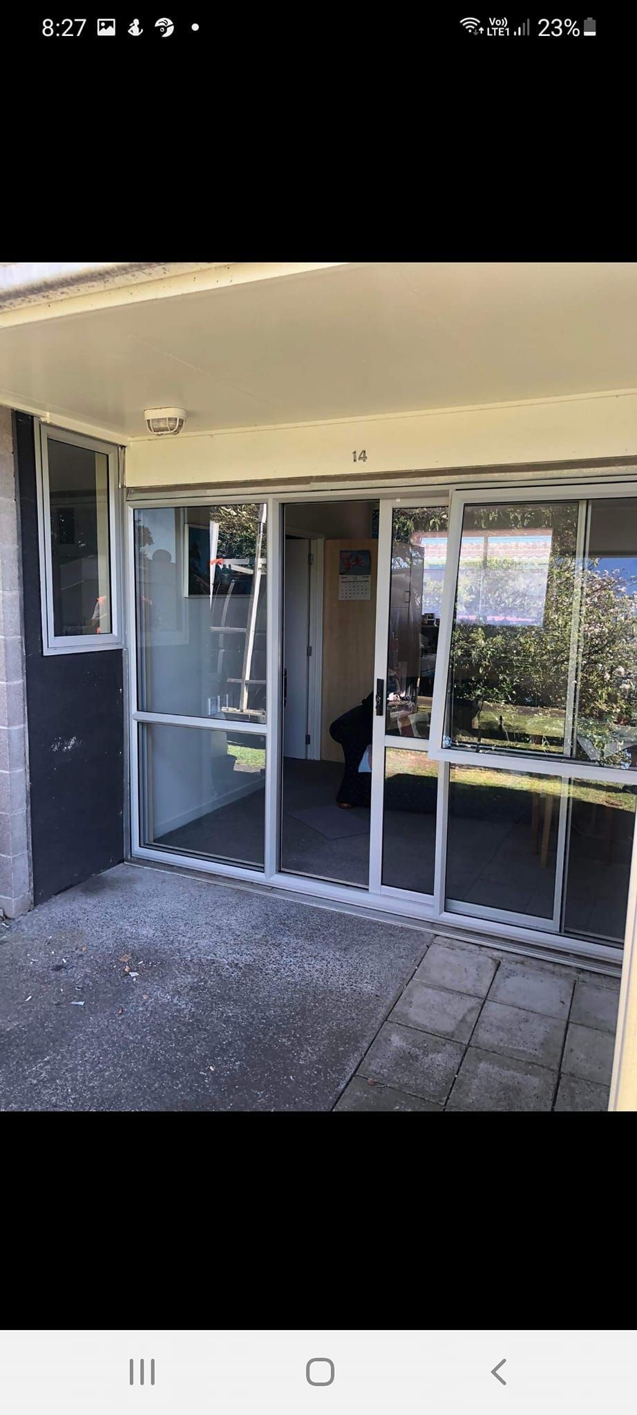 A picture of a house with a sliding glass door.