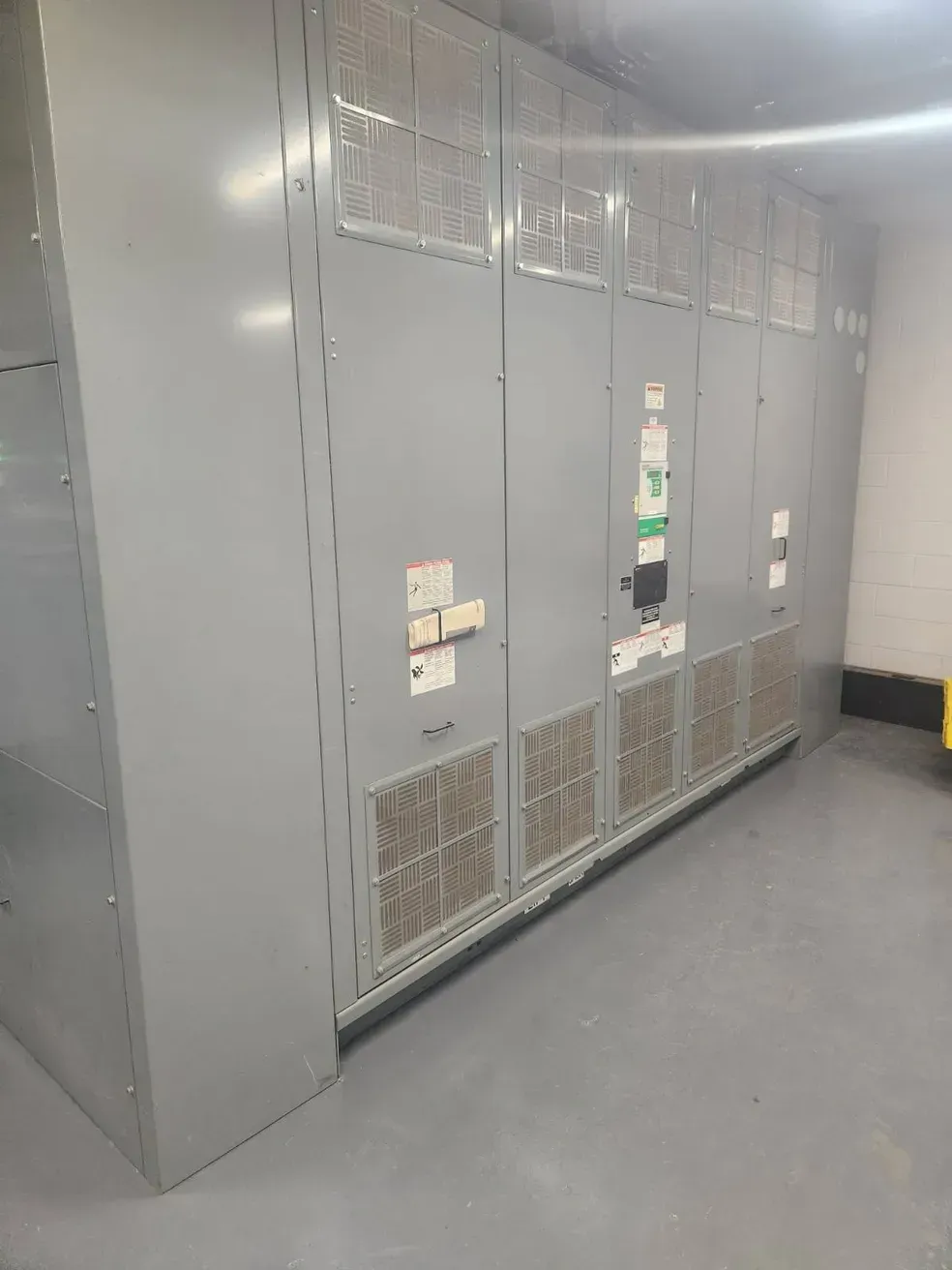 A large room with a lot of electrical boxes on the wall.