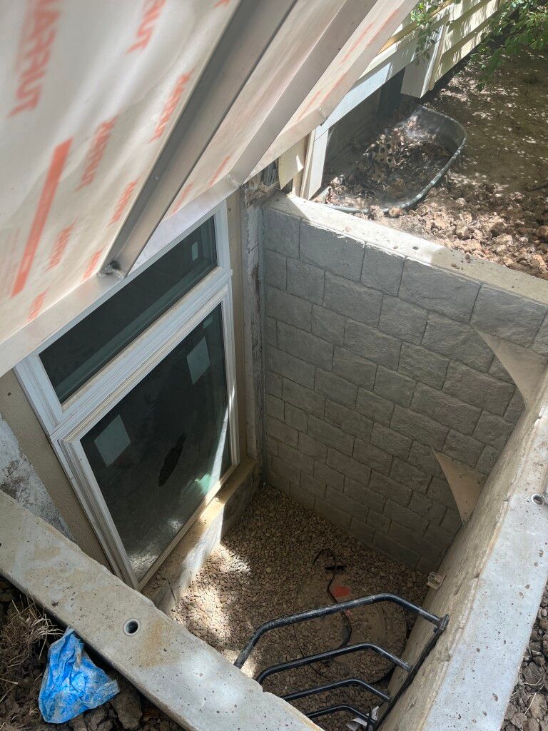 photo of concrete egress window installation