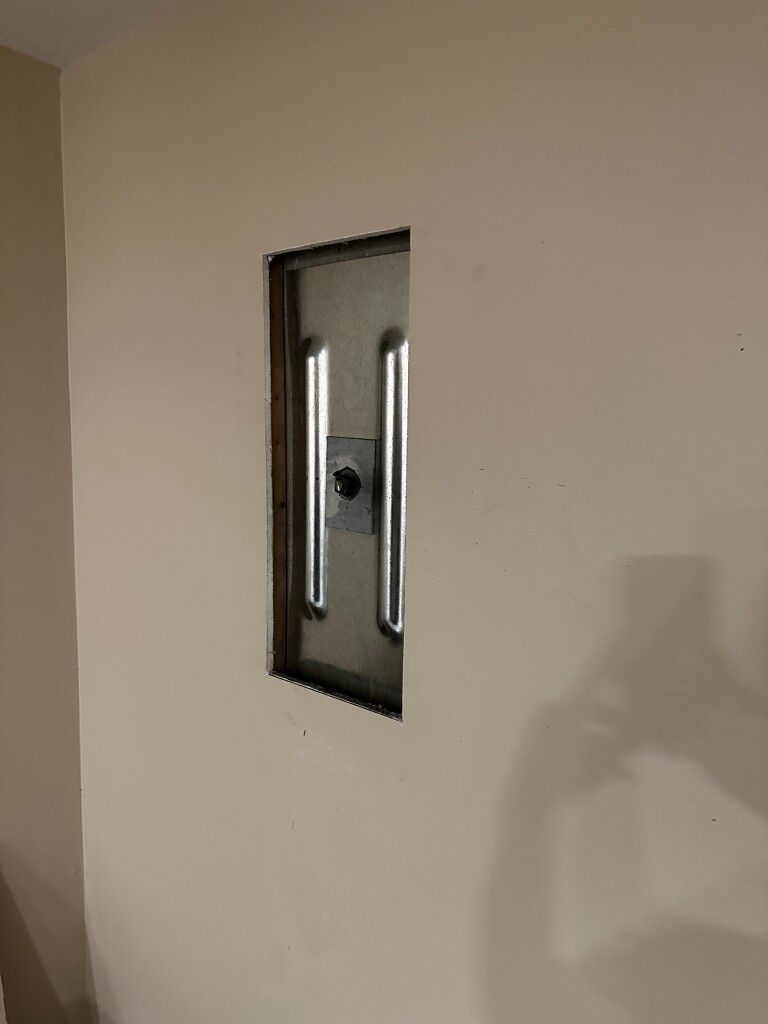 image of wall anchors on bowing wall of basement