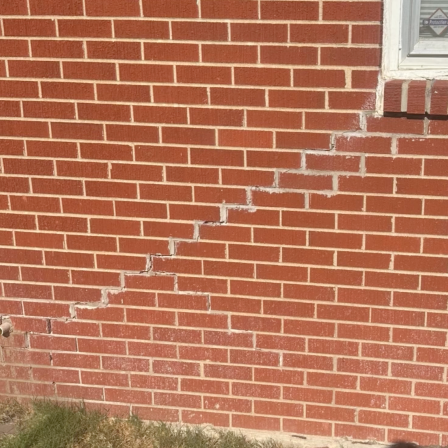 Crawling Crack on Brick Exterior