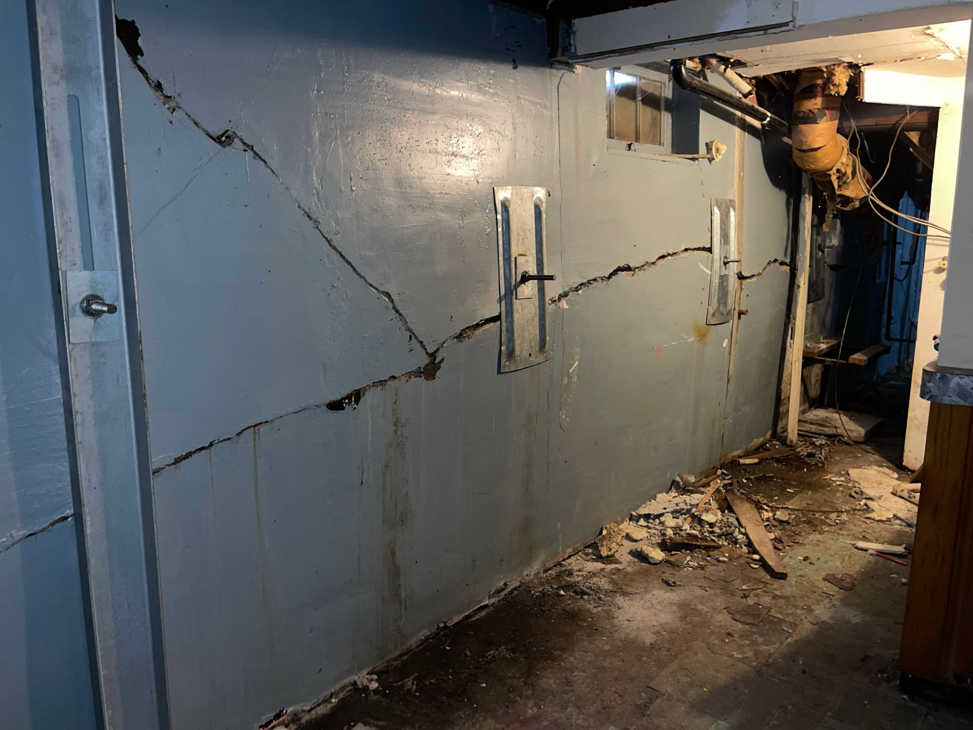 image of helical tiebacks on bowing wall of basement