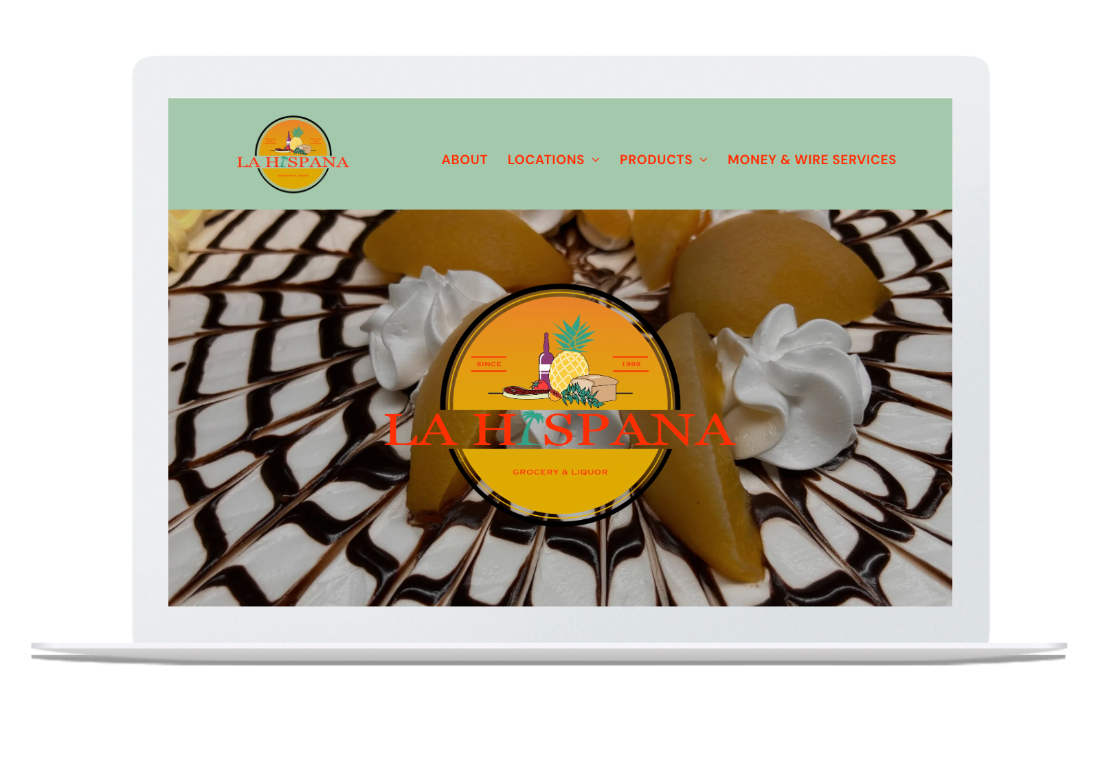 A laptop with a picture of a cake on the screen.